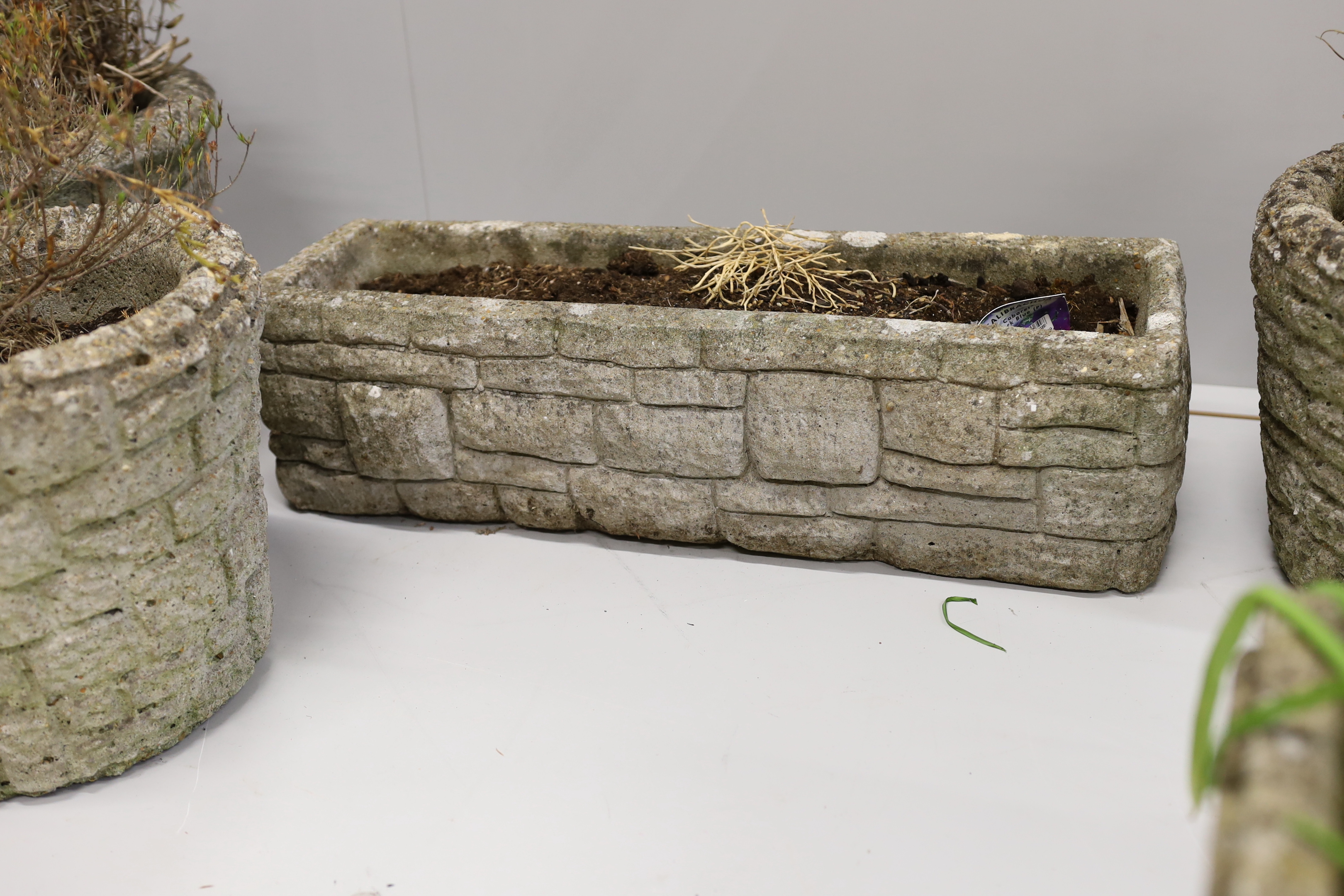 Five reconstituted stone garden planters